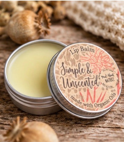 Natural lip balm in a 15ml container made with organic oils by Madaboutnature, featuring a smooth, nourishing balm texture.