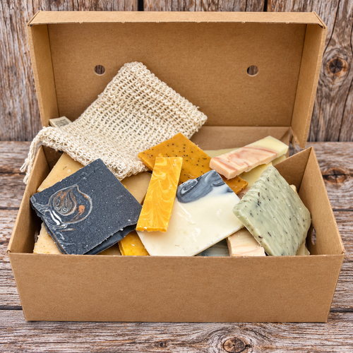 Assorted handmade soap offcuts with soap flakes from Madaboutnature, showing natural, textured soap pieces in a close-up image.
