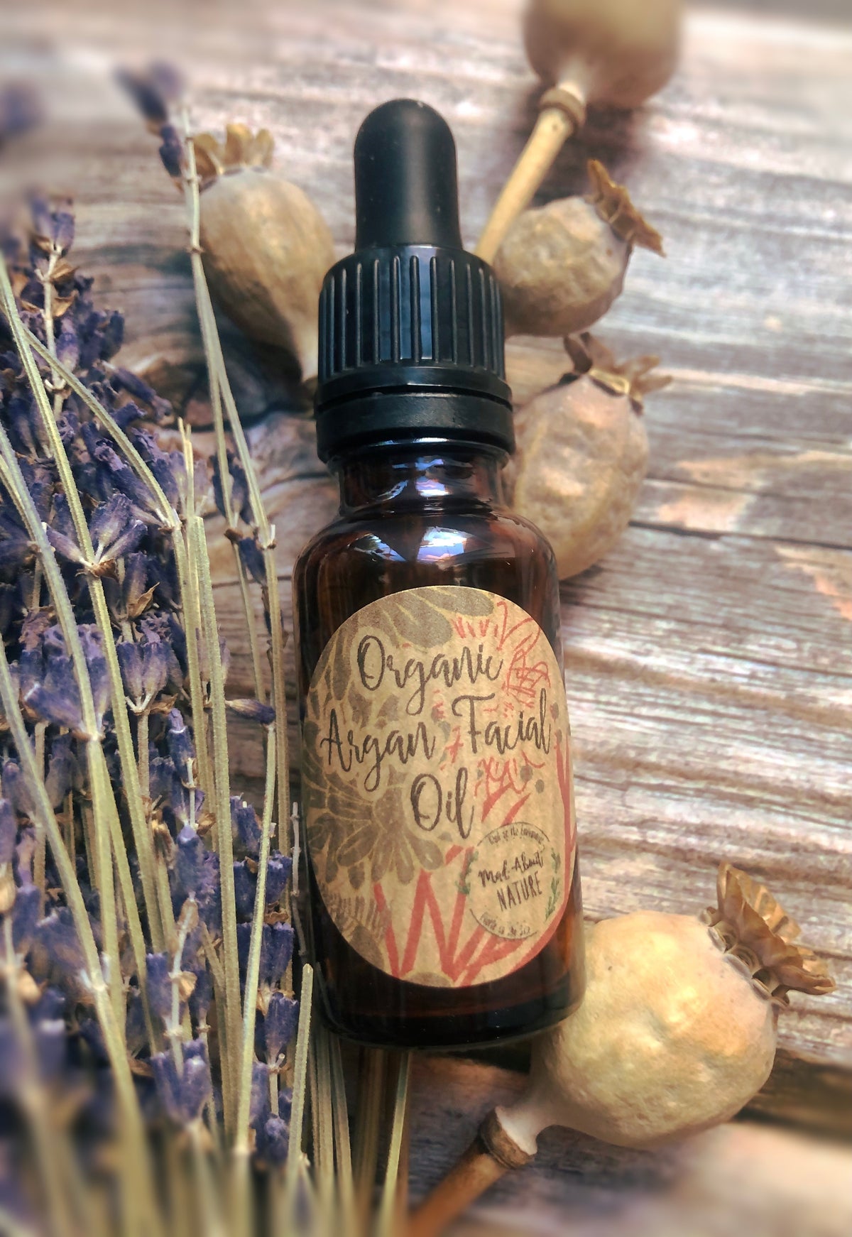 Organic Argan facial oil from Madaboutnature, featuring a clear glass bottle with dropper for skincare application.